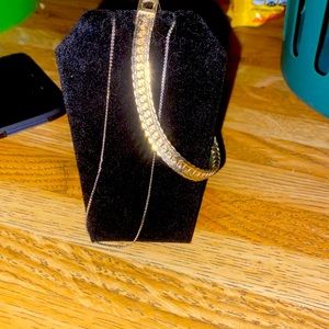 Gold and silver bracelets with golden necklace